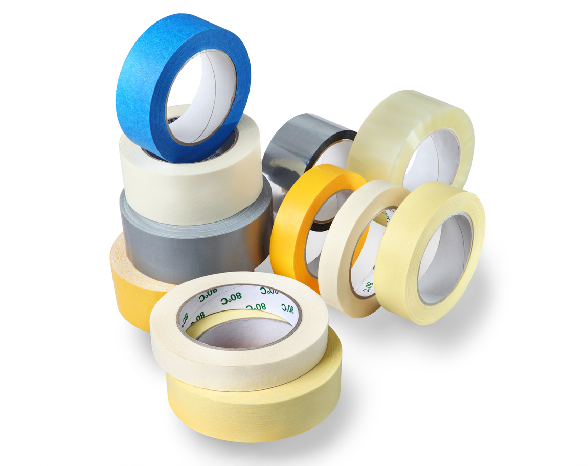 Office supplies, a set of rolls adhesive tape, paper, plastic, various colors and thickness for various purposes, isolated on white background.